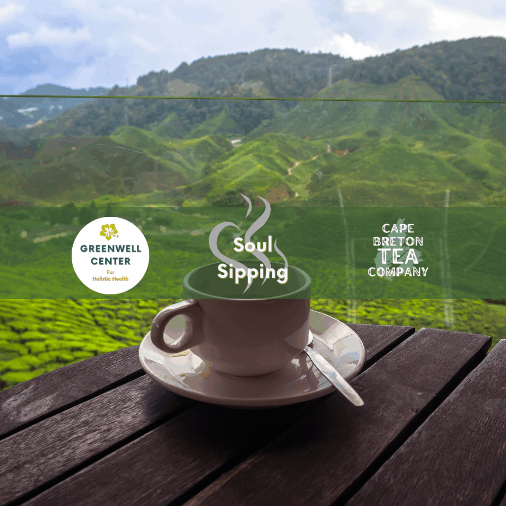 tea cup and saucer on a wooden table overlooking a wooded valley