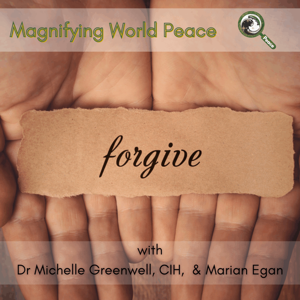 two palms holding a piece of paper with the word forgive on it