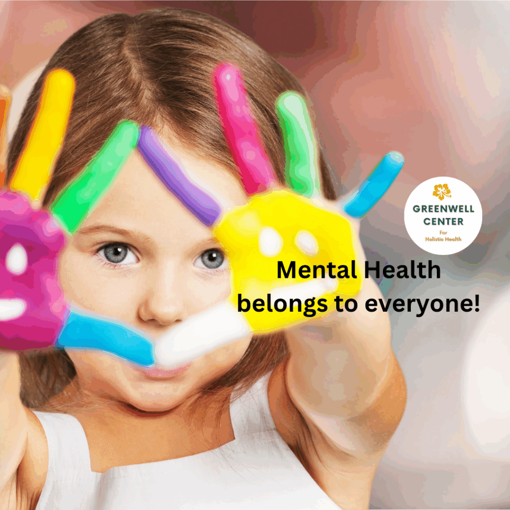 Young girl of 3 with paint on fingers and in a happy face