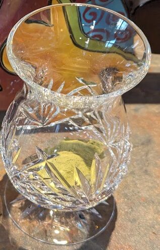 Matcha in a whiskey glass, powder at the bottom