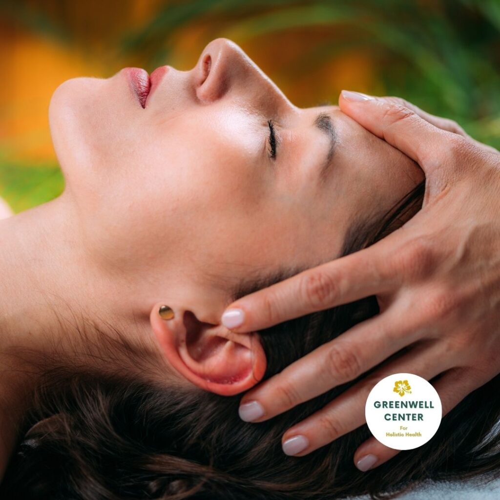 woman lying down and hands are holding her head to relax