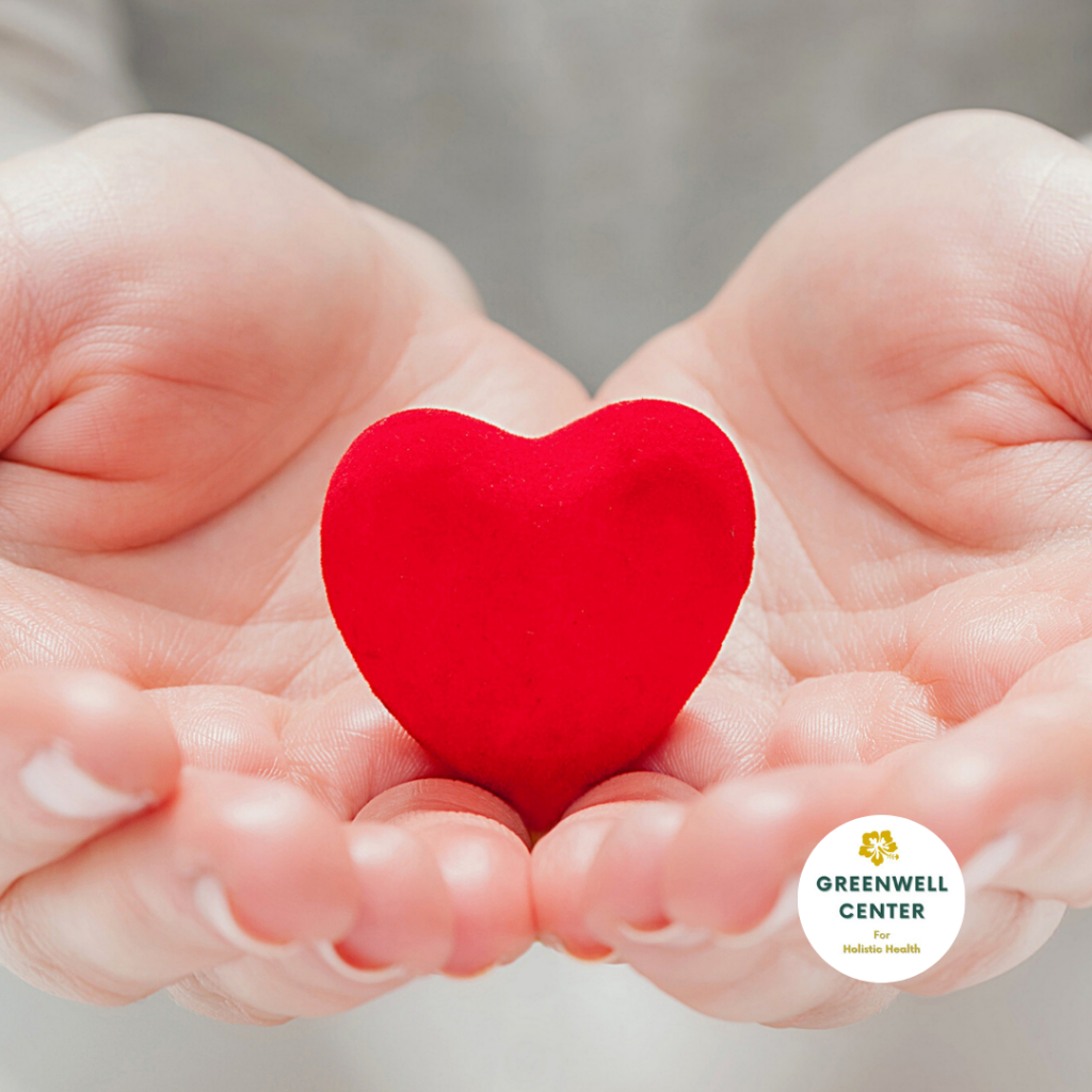 Palm of Hands holding a small heart figure