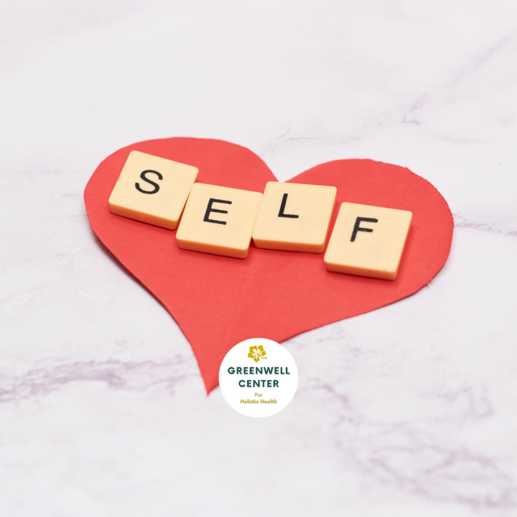 heart made of paper with self in scrabble tiles on top