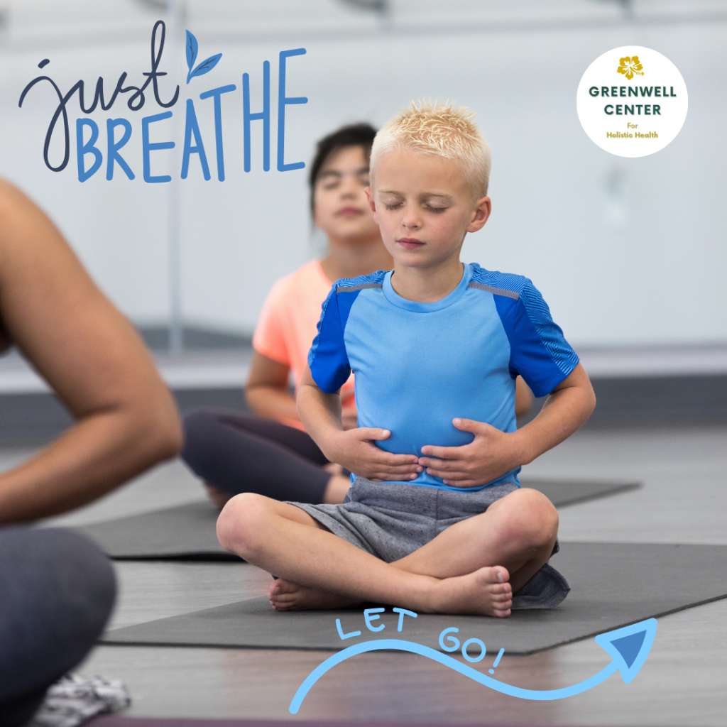 young boy cross legged and breathing: message says 'just breathe...let go'